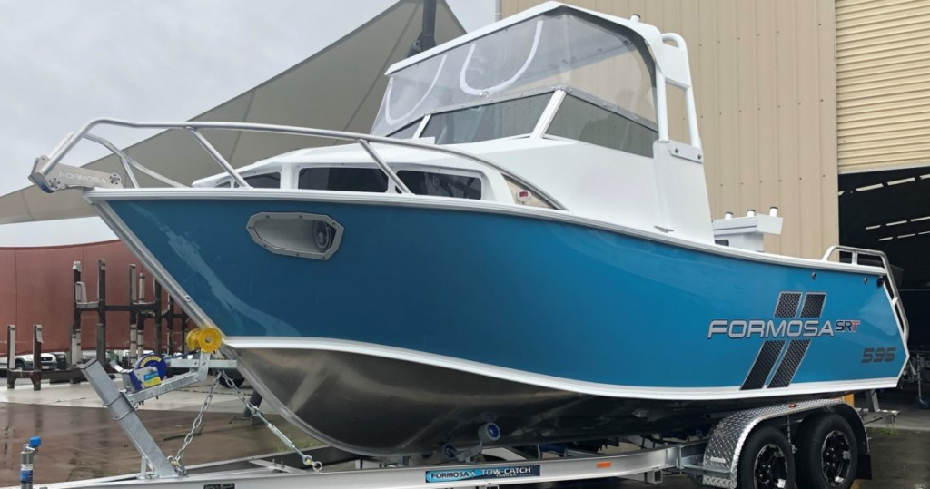 A Formosa Vision Cab boat on a boat trailer after being manufactured and tested.