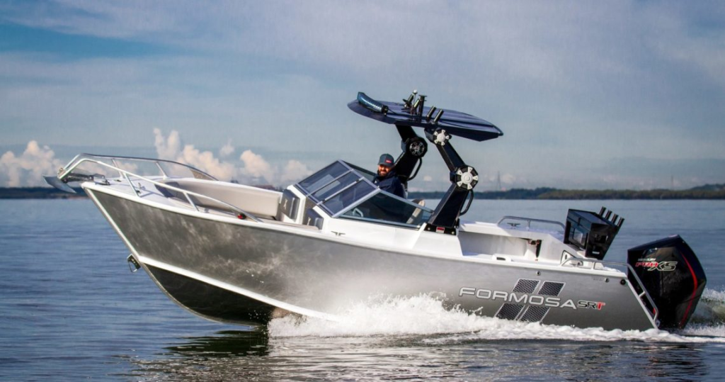 A Formosa X Bowrider boat cruising across open water on a sunny day.