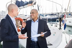 Anew boat buyer is discussing interest rates with the sales person