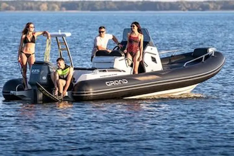 Grand G750 RIB boat with people on the water, highlighting its space and suitability for cruising.
