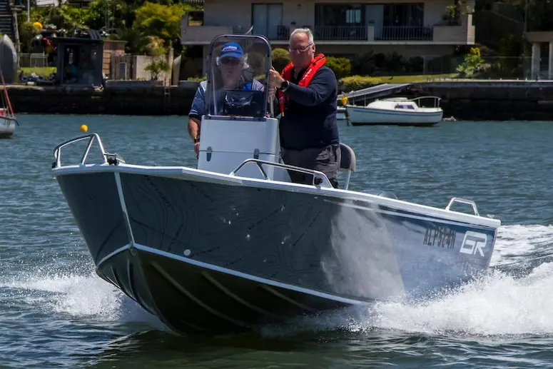 Gulf Runner 510 Bowrider boat with two men on the water, illustrating a top-value boat from 2026.