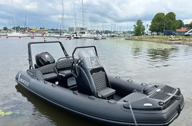 Highfield Sport 560 RIB boat for sale at JADE, shown on water at a marina.
