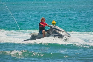 Young man rides a brand new jet-ski he purchased when he had a great opportunity for jet-ski finance.